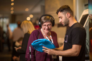 Jo Farquhar looking at hearing tool