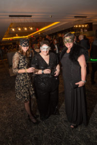 Jo Farquhar with others at a masquerade ball